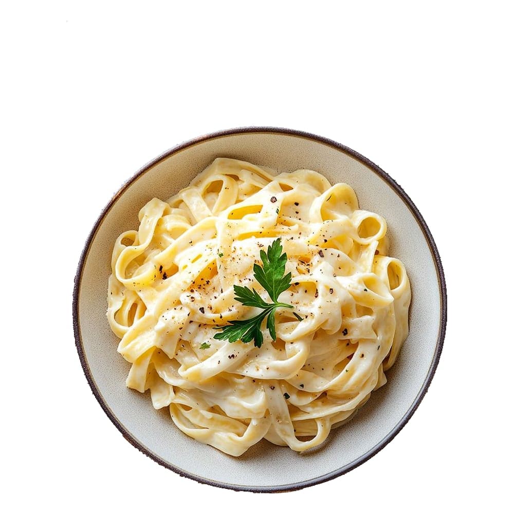 Bowl of creamy fettuccine Alfredo garnished with parsley